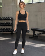 Studio V-Neck Bra and Studio Legging in black, in a strength gym